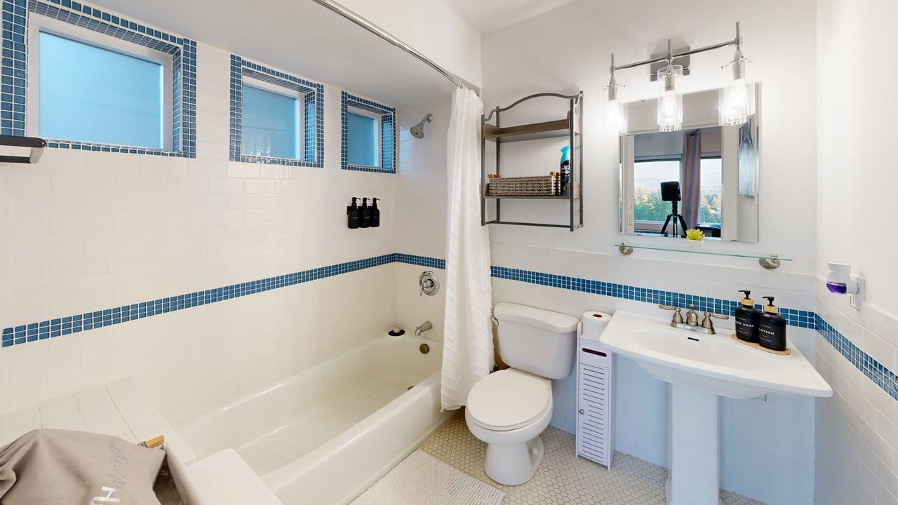 Bathroom with bathtub and shower